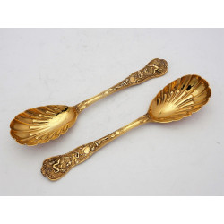 Pair silver gilt Bacchanalian pattern serving spoons