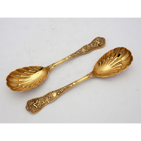 Pair silver gilt Bacchanalian pattern serving spoons