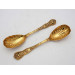 Pair silver gilt Bacchanalian pattern serving spoons
