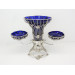 Silver epergne with blue glass liners 1909